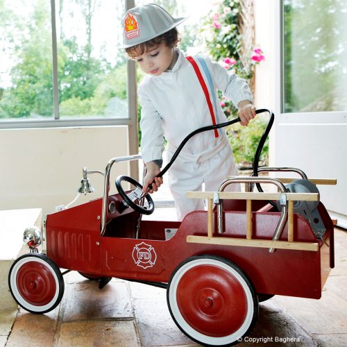 kids ride along red fire engine with child in fireman's hat