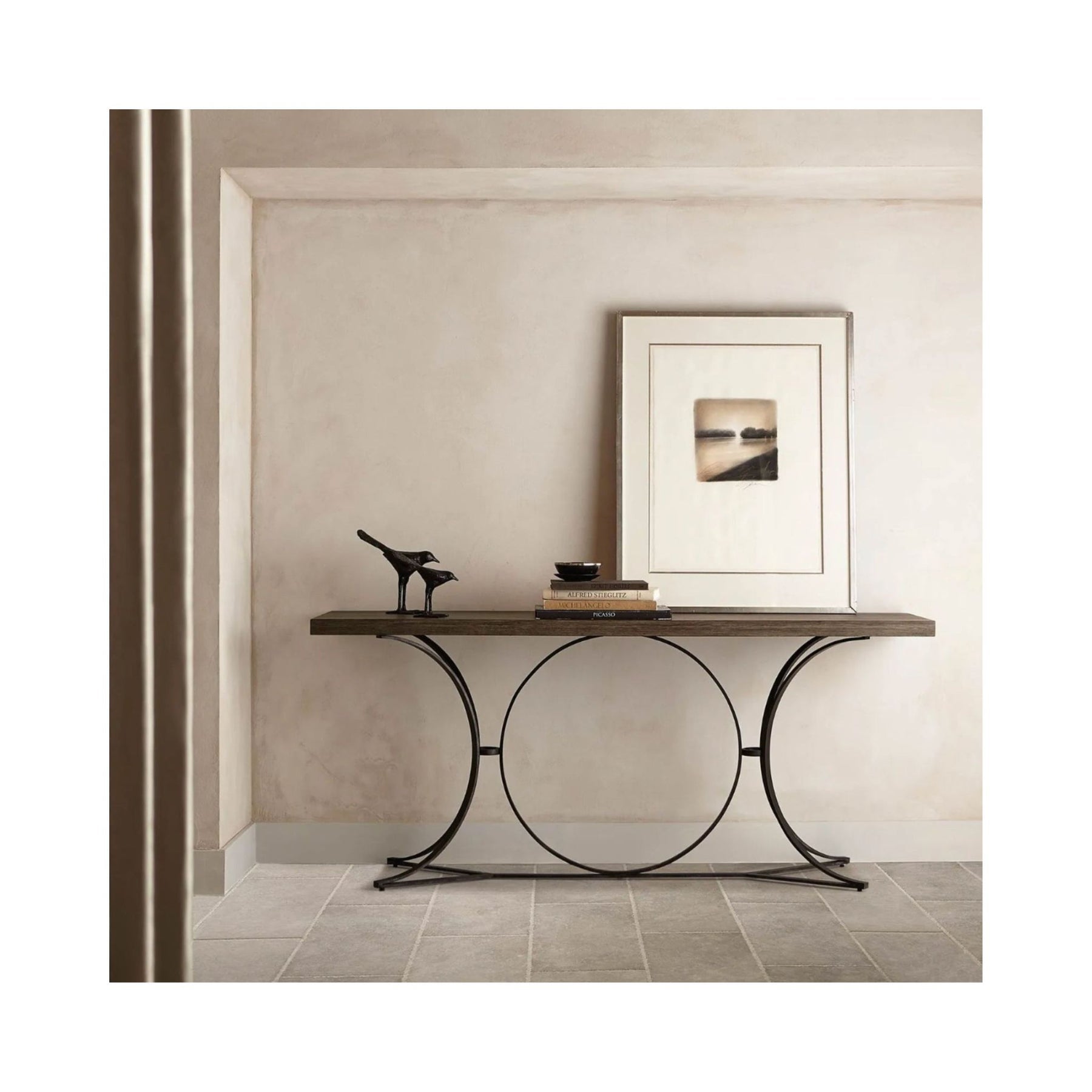Console table with picture frame on top in a cream room