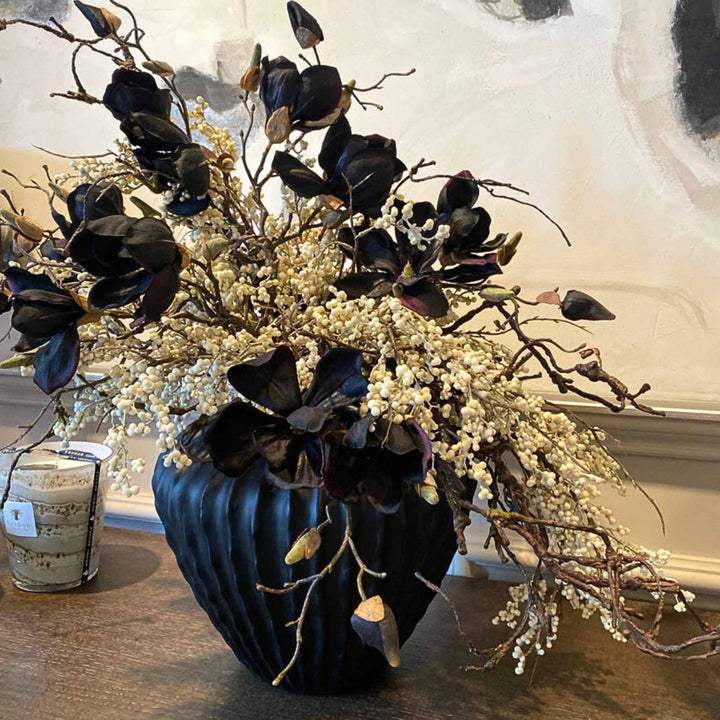 Magnolia and Berries on a black Ridged Vase - Sutherland Interiors