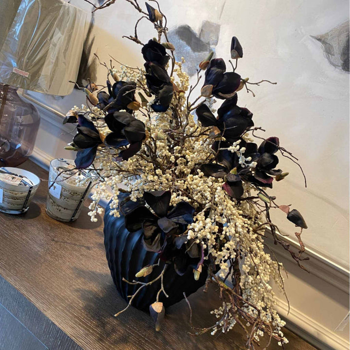 Magnolia and Berries on a black Ridged Vase - Sutherland Interiors