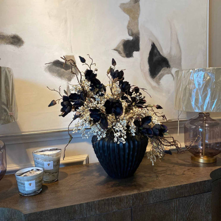Magnolia and Berries on a black Ridged Vase - Sutherland Interiors