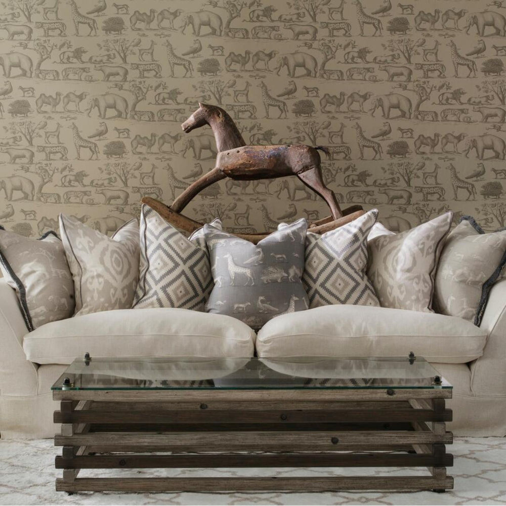 Luxury Cushion in grey and white from andrew martin Ireland on a large sofa with other luxury cushions
